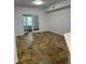 Open living area with tile floors and French doors at 827 Camargo Way # 307, Altamonte Springs, FL 32714