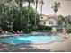 Community pool with lounge chairs and surrounding landscaping at 827 Camargo Way # 307, Altamonte Springs, FL 32714