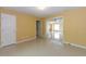 Spacious living room with tile floors and access to other rooms at 5025 E Lake Mary Blvd, Sanford, FL 32771