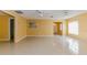 Living room with tile floor and view into kitchen at 5025 E Lake Mary Blvd, Sanford, FL 32771