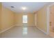 Bright bedroom with tile floors and a large window at 5025 E Lake Mary Blvd, Sanford, FL 32771
