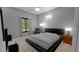 Spacious bedroom with large bed and window at 7629 Riverside Pl, Orlando, FL 32810