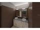 Double vanity bathroom with dark brown tiled walls at 7629 Riverside Pl, Orlando, FL 32810