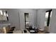Bright dining area with table and chairs, adjacent to kitchen at 7629 Riverside Pl, Orlando, FL 32810