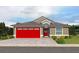 One-story home with red garage door and landscaping at 7629 Riverside Pl, Orlando, FL 32810