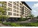 The Flats Orlando: modern building exterior with ample parking at 4849 W Irlo Bronson Hwy # 409, Kissimmee, FL 34746