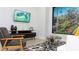 Mid-century modern living room with stylish armchairs and a large TV at 4849 W Irlo Bronson Hwy # Ls101, Kissimmee, FL 34746