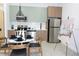Modern kitchen with stainless steel appliances and an eat-in dining area at 4849 W Irlo Bronson Hwy # Ls101, Kissimmee, FL 34746