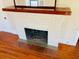 White brick fireplace with wood mantel at 415 Braddock Ave, Daytona Beach, FL 32118
