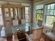 Dining room with glass table, hutch, and hardwood floors at 415 Braddock Ave, Daytona Beach, FL 32118