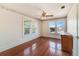 Well-lit bedroom with hardwood floors and two windows at 415 Braddock Ave, Daytona Beach, FL 32118