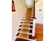 Wooden staircase with patterned runner at 415 Braddock Ave, Daytona Beach, FL 32118