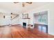 Living room with hardwood floors, fireplace, and staircase at 415 Braddock Ave, Daytona Beach, FL 32118