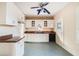 White kitchen with granite countertops and appliances at 415 Braddock Ave, Daytona Beach, FL 32118