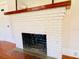 White brick fireplace with wood mantel at 415 Braddock Ave, Daytona Beach, FL 32118