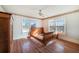 Bright bedroom with hardwood floors and a wooden sleigh bed at 415 Braddock Ave, Daytona Beach, FL 32118