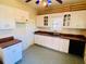 White kitchen cabinets and tiled floor at 415 Braddock Ave, Daytona Beach, FL 32118