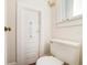 Small bathroom with toilet and door at 415 Braddock Ave, Daytona Beach, FL 32118