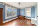 Bedroom with hardwood floors, two windows, and built-in bench at 415 Braddock Ave, Daytona Beach, FL 32118