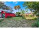 Spacious backyard with a red shed and room for a garden at 415 Braddock Ave, Daytona Beach, FL 32118