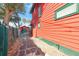 Side yard with detached garage and paved driveway at 415 Braddock Ave, Daytona Beach, FL 32118