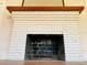 White brick fireplace with wood mantel at 415 Braddock Ave, Daytona Beach, FL 32118