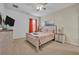 Guest bedroom with a queen-size bed and beachy decor at 5244 Oakbourne Ave, Davenport, FL 33837