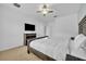 Main bedroom with king-size bed, neutral colors, and a ceiling fan at 5244 Oakbourne Ave, Davenport, FL 33837