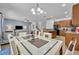 Open concept dining area with kitchen view at 5244 Oakbourne Ave, Davenport, FL 33837