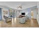 Living room with gray couches and access to a back patio at 5244 Oakbourne Ave, Davenport, FL 33837