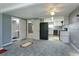 Modern kitchen with white cabinets, granite countertops, and black appliances at 14650 Liberty St, Orlando, FL 32826