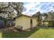 Small yellow shed in the backyard at 14650 Liberty St, Orlando, FL 32826