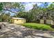 Backyard view of house with shed and trees at 14650 Liberty St, Orlando, FL 32826