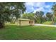 Yellow house exterior with a spacious yard at 14650 Liberty St, Orlando, FL 32826