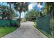 Driveway leading to the house with a gate at 14650 Liberty St, Orlando, FL 32826