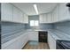 Modern galley kitchen with white cabinets and granite countertops at 14650 Liberty St, Orlando, FL 32826