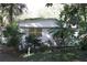 White mobile home with mature landscaping at 770 Snow Hill Rd, Geneva, FL 32732