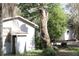 A white building next to a large tree stump at 770 Snow Hill Rd, Geneva, FL 32732