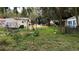 Overgrown lot with several buildings at 770 Snow Hill Rd, Geneva, FL 32732
