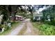 Gravel driveway, red house, and mobile home at 770 Snow Hill Rd, Geneva, FL 32732