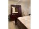 Bedroom with a dark wood sleigh bed and dresser at 1023 W Gore W St, Orlando, FL 32805