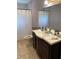 Clean bathroom with dark vanity and updated fixtures at 1023 W Gore W St, Orlando, FL 32805