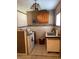 Small kitchen with wood cabinets and appliances at 1023 W Gore W St, Orlando, FL 32805