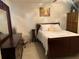 Bedroom with a dark wood sleigh bed and dresser at 1023 W Gore W St, Orlando, FL 32805