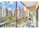 Screened balcony with outdoor seating and courtyard view at 14501 Grove Resort Ave # 1430, Winter Garden, FL 34787