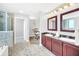 Elegant bathroom with double sinks, walk-in shower, and large mirror at 14501 Grove Resort Ave # 1430, Winter Garden, FL 34787