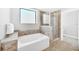 Clean bathroom featuring a bathtub, shower, and tile flooring at 14501 Grove Resort Ave # 1430, Winter Garden, FL 34787