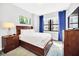 Comfortable bedroom with a queen-size bed and neutral color scheme at 14501 Grove Resort Ave # 1430, Winter Garden, FL 34787
