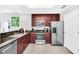 Modern kitchen with stainless steel appliances and granite countertops at 14501 Grove Resort Ave # 1430, Winter Garden, FL 34787