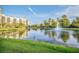 Scenic lake view with a tranquil fountain and lush landscape at 14501 Grove Resort Ave # 1430, Winter Garden, FL 34787